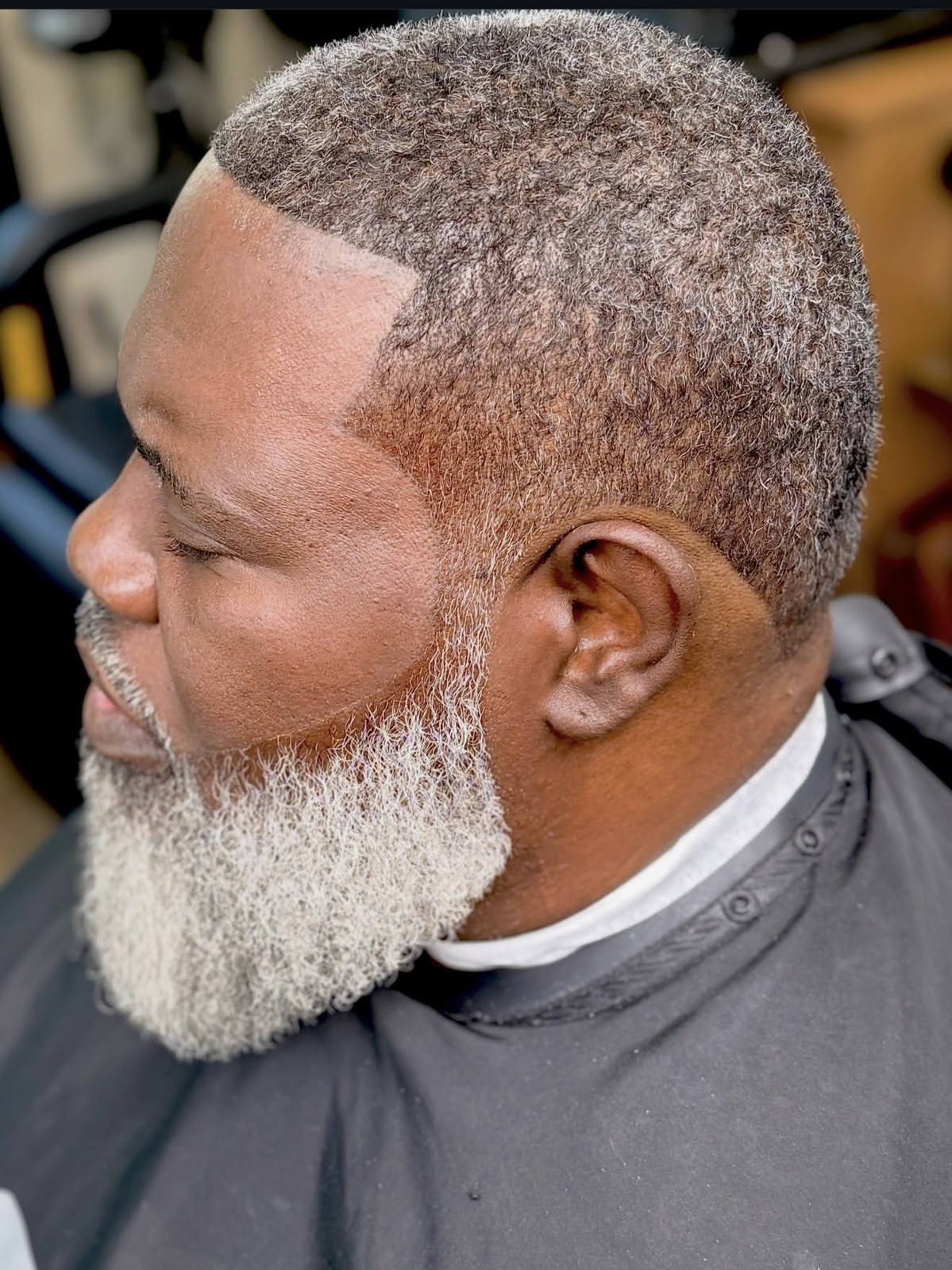 Precision haircut and sculpted silver beard